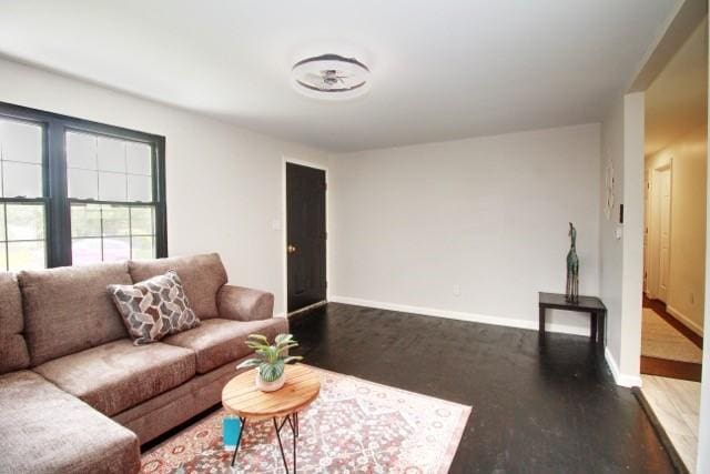 513 Crestview Dr, Plum Boro, PA 15239 - living room featuring baseboards and wood finished floors