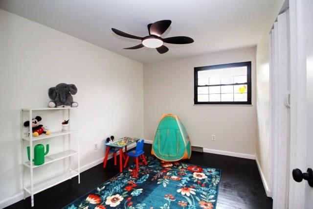 513 Crestview Dr, Plum Boro, PA 15239 - recreation room featuring wood finished floors, baseboards, and ceiling fan