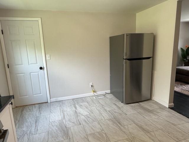 513 Crestview Dr, Plum Boro, PA 15239 - kitchen featuring freestanding refrigerator, dark countertops, white cabinets, and baseboards
