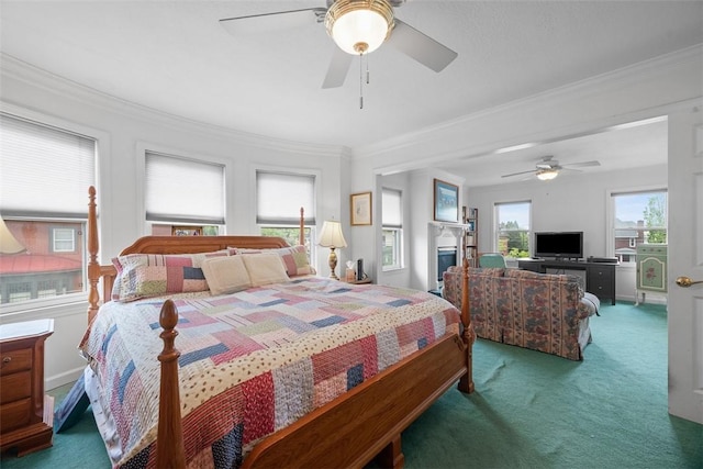 carpeted bedroom with crown molding and ceiling fan