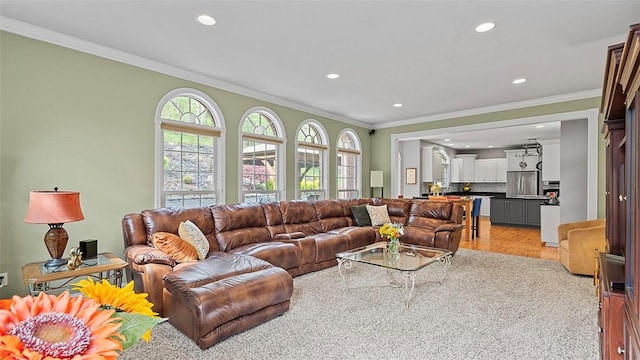 living area featuring recessed lighting, ornamental molding, and light wood-style flooring