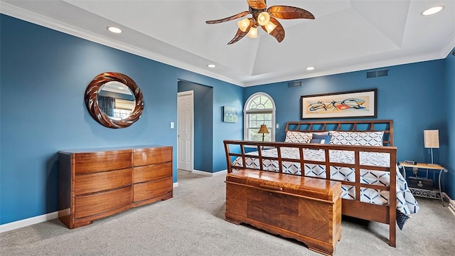 bedroom featuring light carpet, recessed lighting, baseboards, a raised ceiling, and ornamental molding
