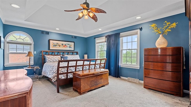 carpeted bedroom with a raised ceiling, recessed lighting, baseboards, crown molding, and ceiling fan