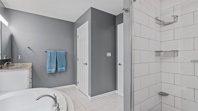 bathroom featuring a garden tub, vanity, tiled shower, and tile patterned flooring