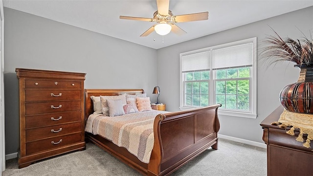 carpeted bedroom with baseboards and ceiling fan