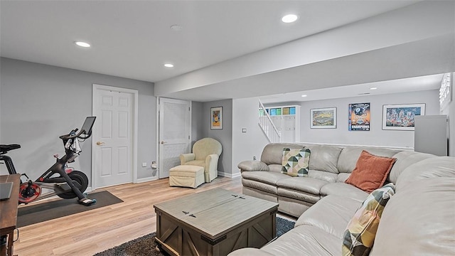 living room featuring wood finished floors, recessed lighting, and baseboards