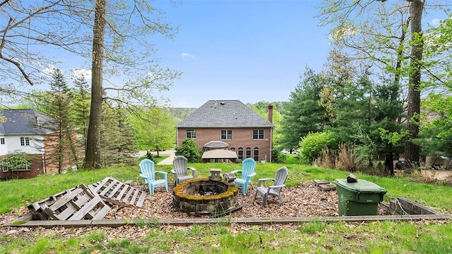 view of yard featuring an outdoor fire pit