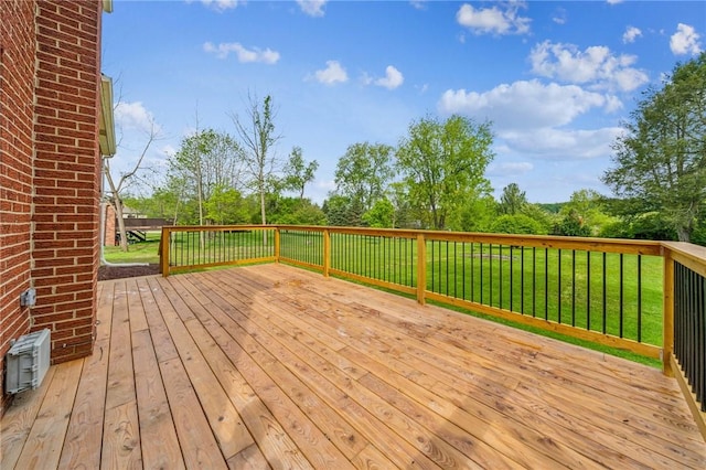 wooden terrace with a yard