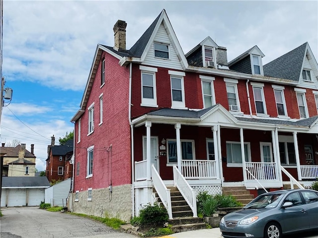 811 Farragut St, Highland Park, PA 15206 - view of property with brick siding, a porch, and a chimney