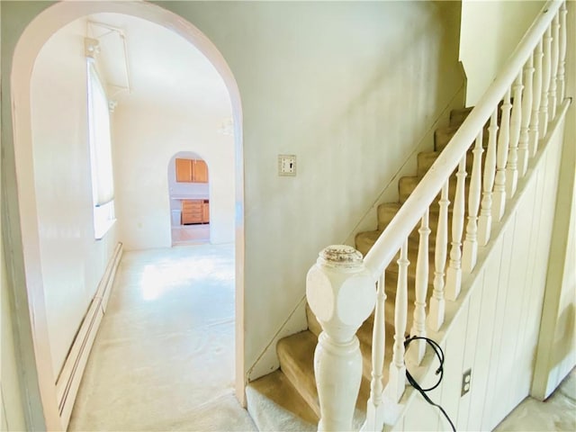 811 Farragut St, Highland Park, PA 15206 - staircase with arched walkways, carpet flooring, and a baseboard heating unit