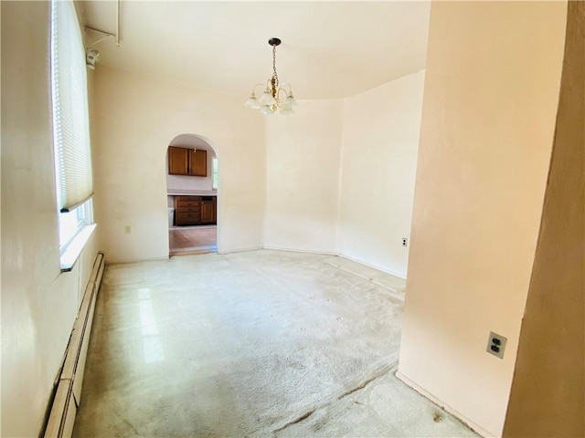 811 Farragut St, Highland Park, PA 15206 - spare room with arched walkways, a chandelier, light carpet, and a baseboard radiator