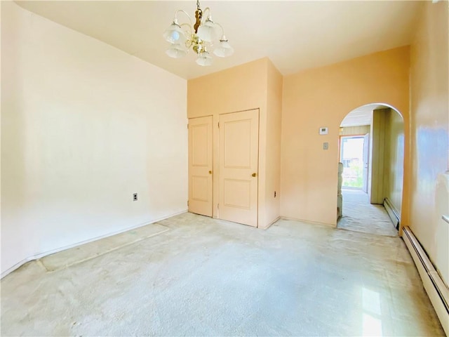 811 Farragut St, Highland Park, PA 15206 - spare room with a baseboard radiator, arched walkways, light carpet, and a chandelier