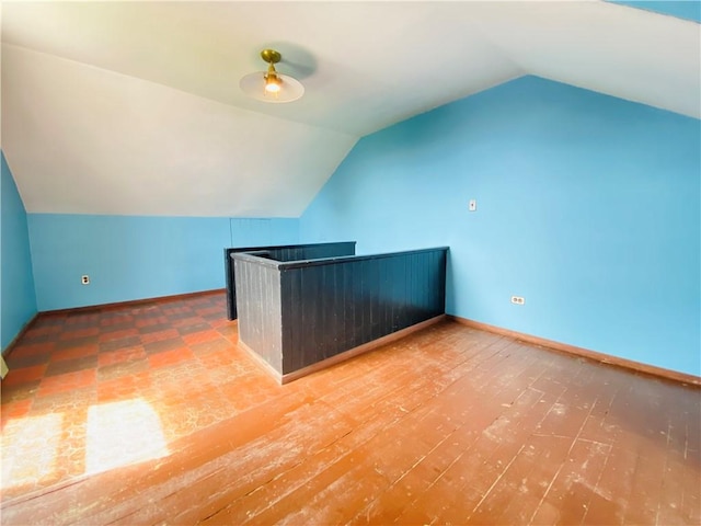 811 Farragut St, Highland Park, PA 15206 - bonus room featuring lofted ceiling, baseboards, and wood finished floors