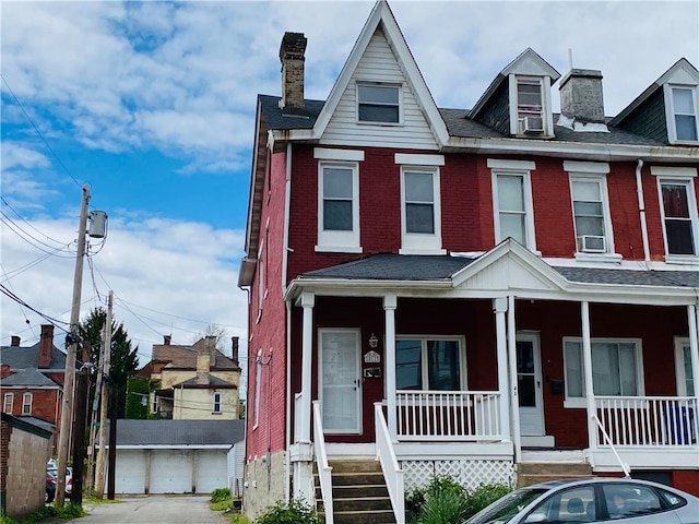 811 Farragut St, Highland Park, PA 15206 - view of property featuring a porch, a chimney, and brick siding