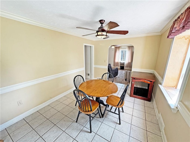 5422 Library Rd, Bethel Park, PA 15102 - dining space featuring arched walkways, a ceiling fan, light tile patterned flooring, baseboards, and ornamental molding