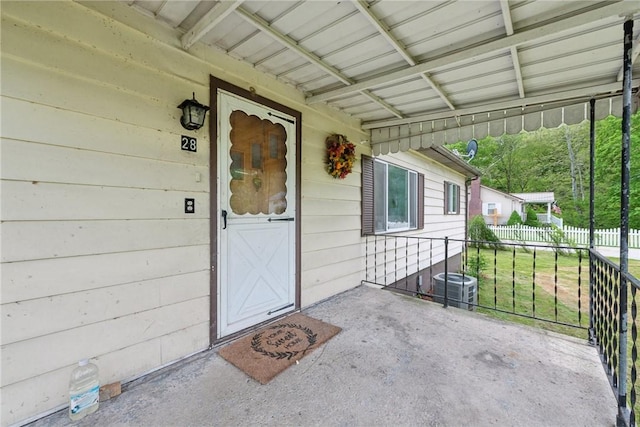 28 Main St, Clarksville, PA 15322 - view of exterior entry with cooling unit, a porch, and fence