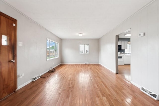 28 Main St, Clarksville, PA 15322 - unfurnished living room featuring light wood-style flooring, baseboards, and ornamental molding