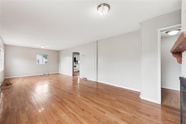 28 Main St, Clarksville, PA 15322 - unfurnished living room with light wood-style floors and baseboards