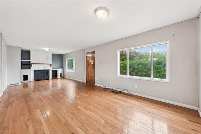 28 Main St, Clarksville, PA 15322 - unfurnished living room featuring light wood-style flooring, healthy amount of natural light, and baseboards