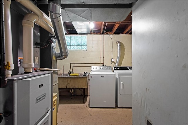 230 Brookwood Rd, Peters Twp, PA 15367 - laundry area featuring washer and dryer, heating unit, and concrete block wall