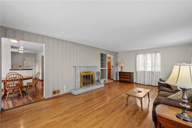 230 Brookwood Rd, Peters Twp, PA 15367 - living area featuring light wood finished floors and a fireplace