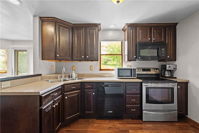230 Brookwood Rd, Peters Twp, PA 15367 - kitchen with black appliances, a sink, dark wood-type flooring, dark brown cabinets, and light countertops