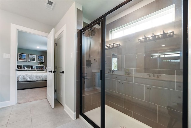 bathroom featuring a shower stall, ensuite bath, healthy amount of natural light, and baseboards