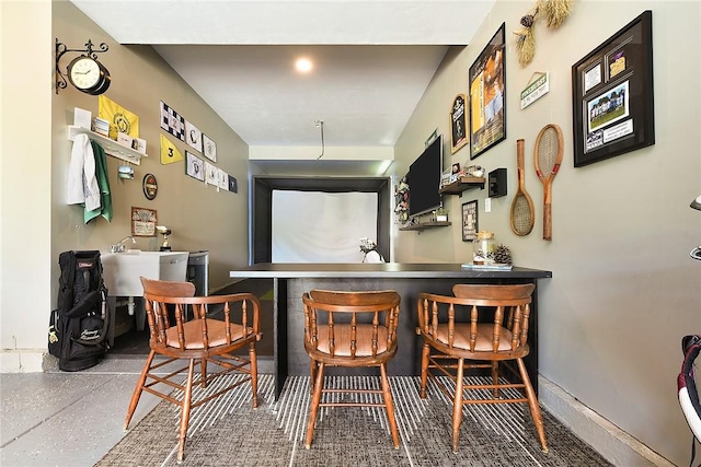 indoor dry bar featuring speckled floor
