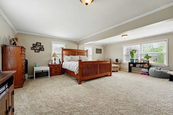 carpeted bedroom featuring ornamental molding and baseboards