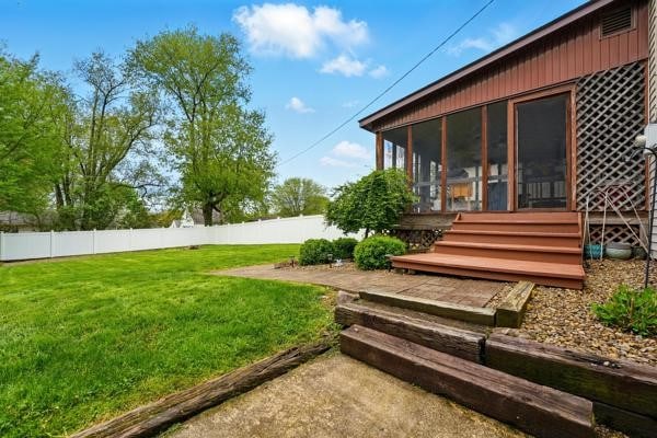 view of yard with a sunroom