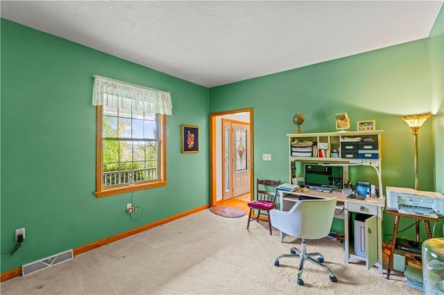 carpeted office space with baseboards