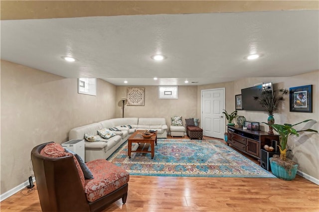living area featuring wood finished floors, recessed lighting, and baseboards