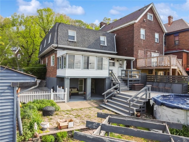 rear view of house featuring stairs, a shingled roof, a patio, and fence
