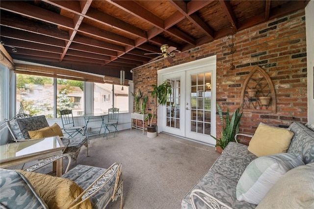 sunroom / solarium featuring french doors, ceiling fan, and outdoor lounge area