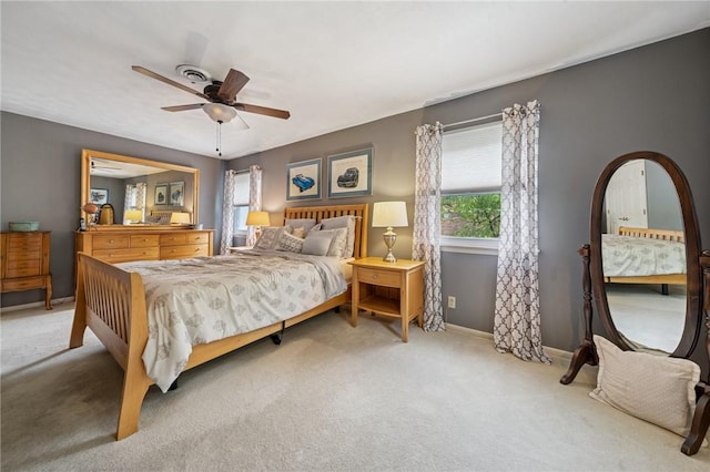 bedroom with carpet flooring, baseboards, and ceiling fan