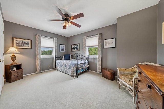 bedroom with carpet flooring, baseboards, and ceiling fan
