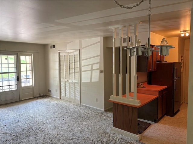 empty room with light colored carpet and baseboards