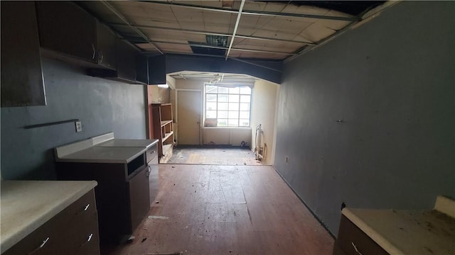 below grade area with light wood-type flooring