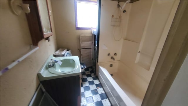 bathroom featuring tile patterned floors, vanity, and shower / washtub combination