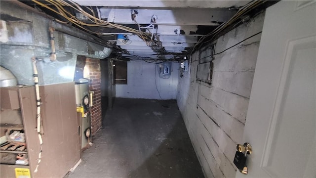 unfinished below grade area with heating unit and electric panel
