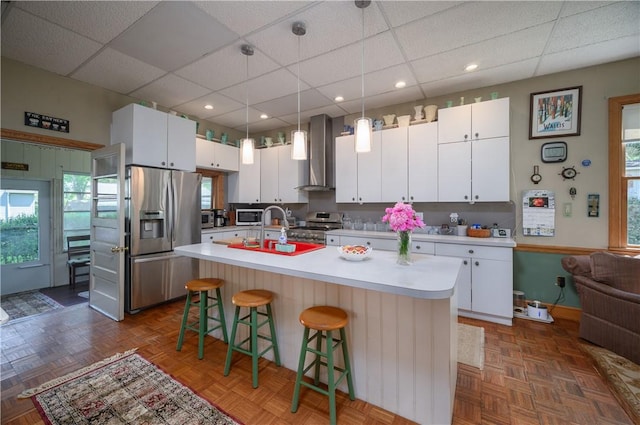 115 River Ave, Glenfield, PA 15143 - kitchen with appliances with stainless steel finishes, wall chimney range hood, a paneled ceiling, a sink, and light countertops