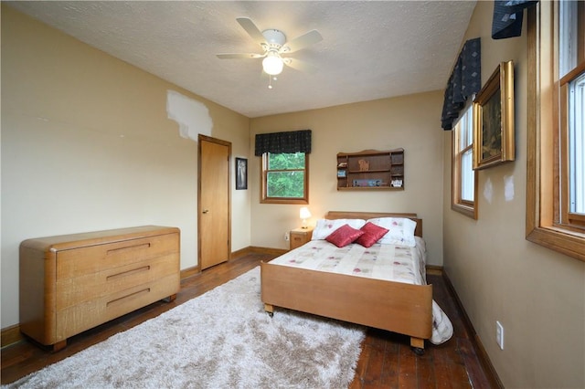 115 River Ave, Glenfield, PA 15143 - bedroom with wood finished floors, baseboards, a textured ceiling, and a ceiling fan