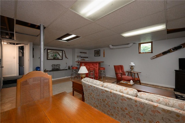115 River Ave, Glenfield, PA 15143 - living room with a drop ceiling, baseboards, a bar, and wood finished floors