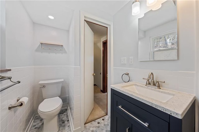 149 Fairfax Rd, Forest Hills Boro, PA 15221 - bathroom featuring tile walls, vanity, toilet, a wainscoted wall, and tile patterned flooring