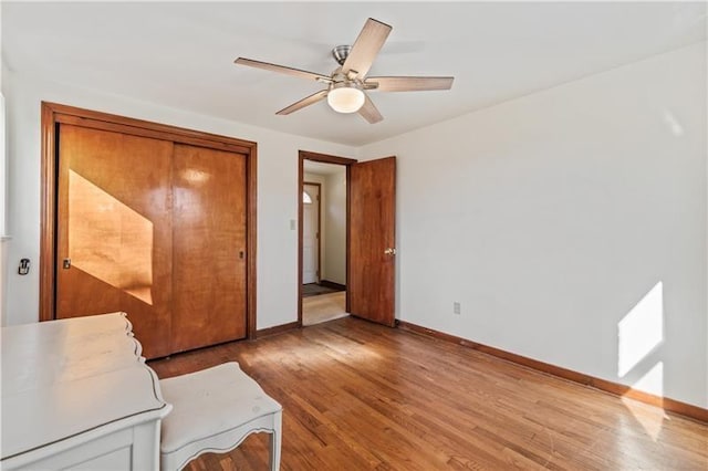 149 Fairfax Rd, Forest Hills Boro, PA 15221 - unfurnished bedroom featuring baseboards, wood finished floors, ceiling fan, and a closet