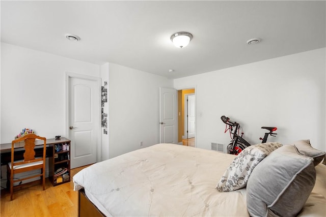 bedroom featuring light wood-style floors
