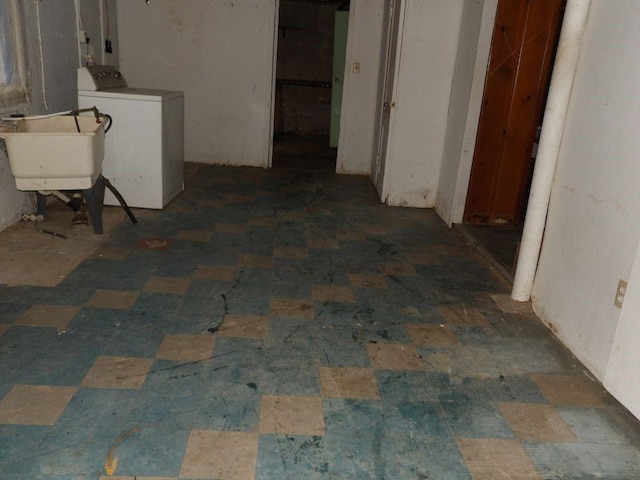 basement with washer / dryer and a sink