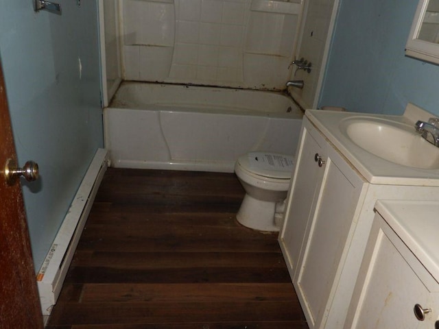 full bathroom featuring wood finished floors, vanity, toilet, separate washer and dryer, and  shower combination