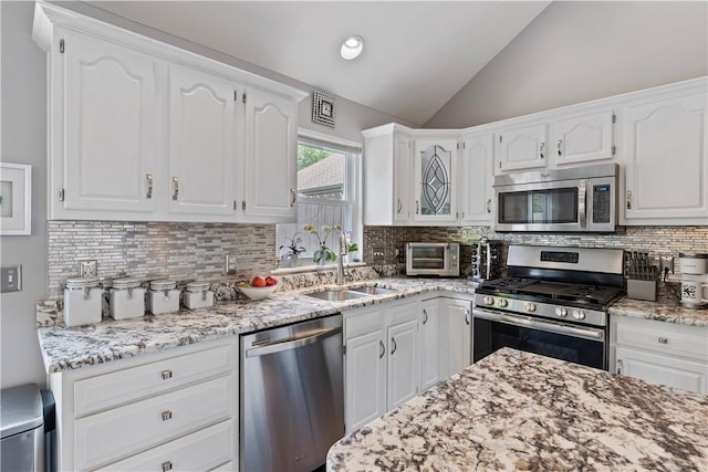 113 Seavey Highlands, Shaler, PA 15223 - kitchen featuring stainless steel appliances, a sink, lofted ceiling, and white cabinetry