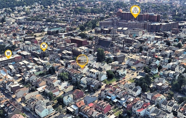 aerial view of property and surrounding area featuring nearby urban area